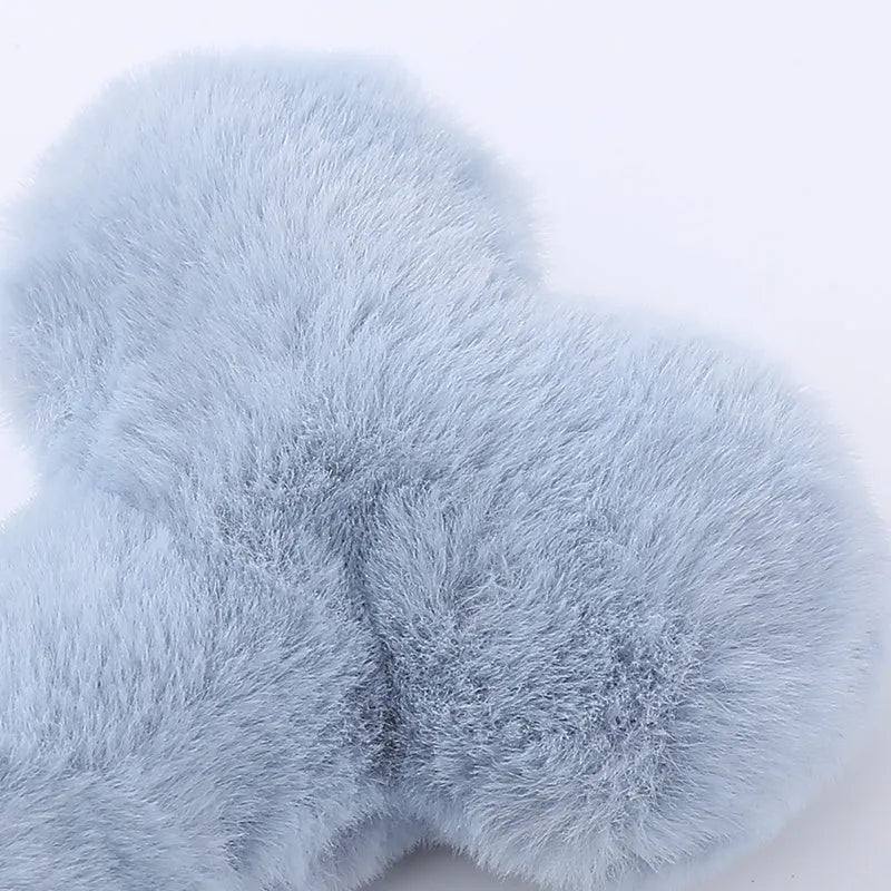 Blue plush love bone dog toy with squeaker for bite-resistant interactive play.