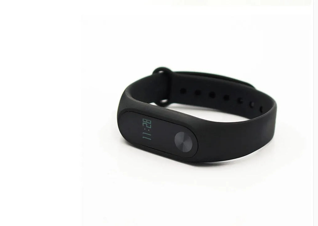 Xiaomi Mi Band 2 black fitness tracker with OLED screen on an adjustable thermoplastic elastomer wrist strap.