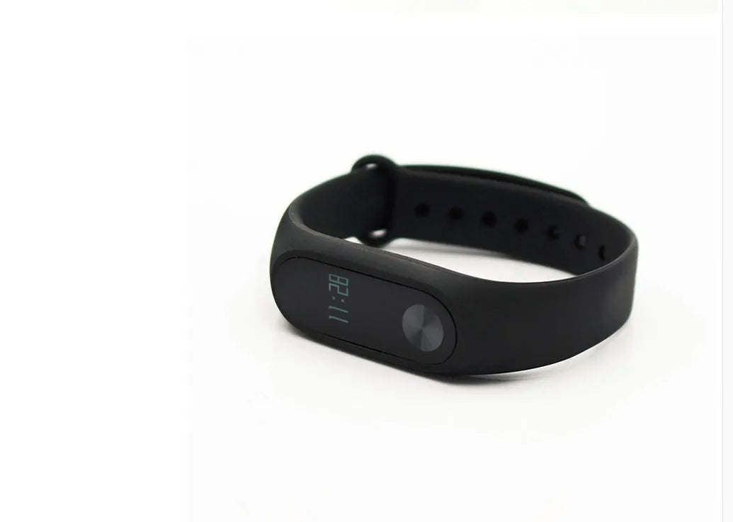 Xiaomi Mi Band 2 black fitness tracker with OLED screen on an adjustable thermoplastic elastomer wrist strap.
