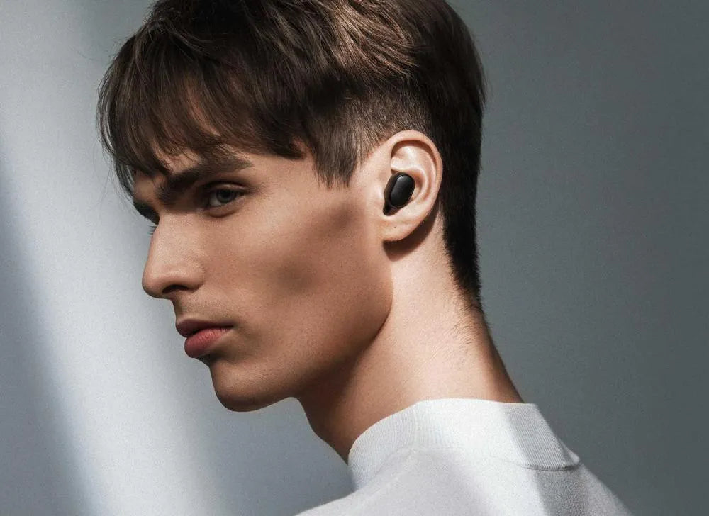 Black Redmi AirDots 2 true wireless earbuds with their compact charging case.