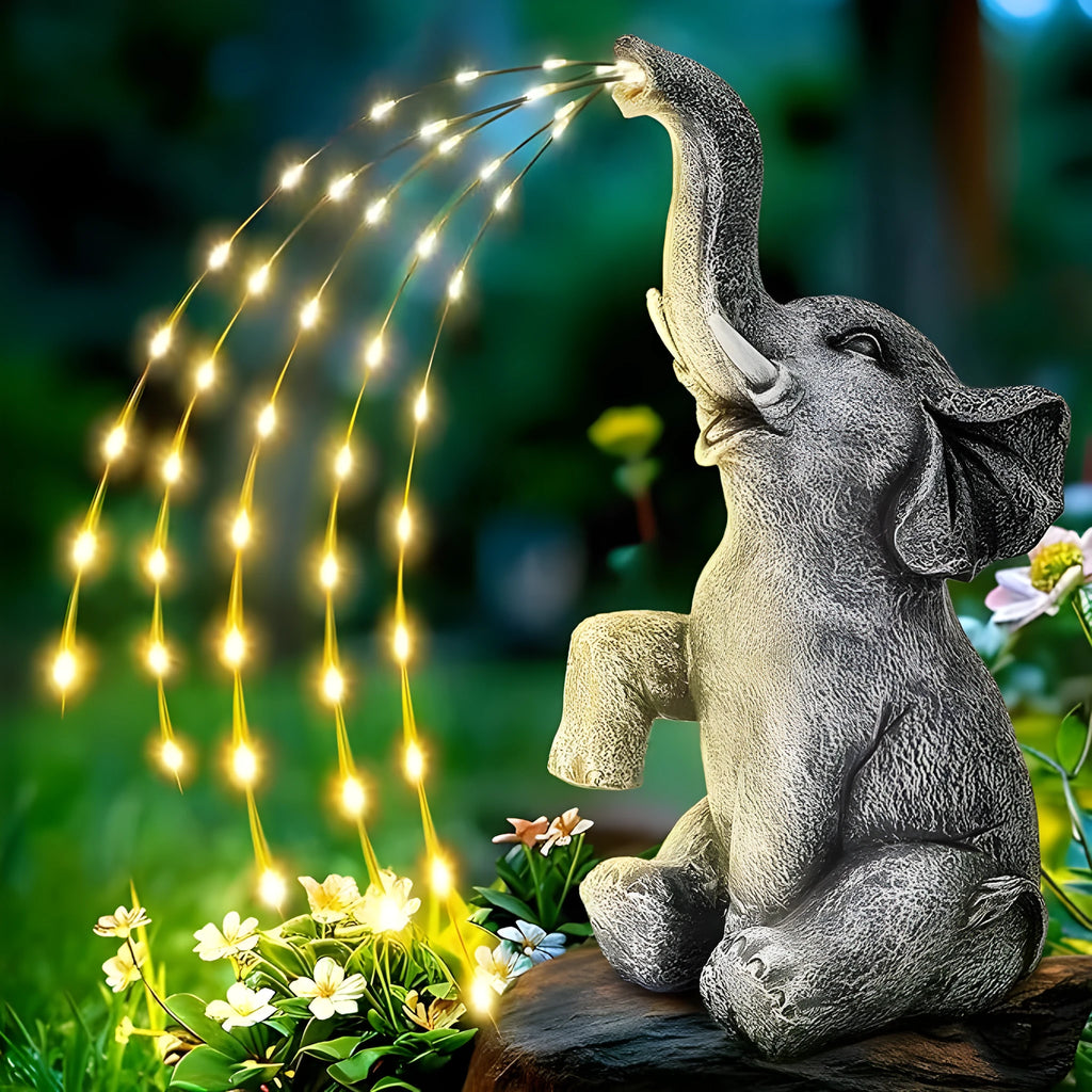 Resin elephant garden sculpture with integrated light strip for outdoor patio or lawn decoration.