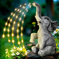 Resin elephant garden sculpture with integrated light strip for outdoor patio or lawn decoration.