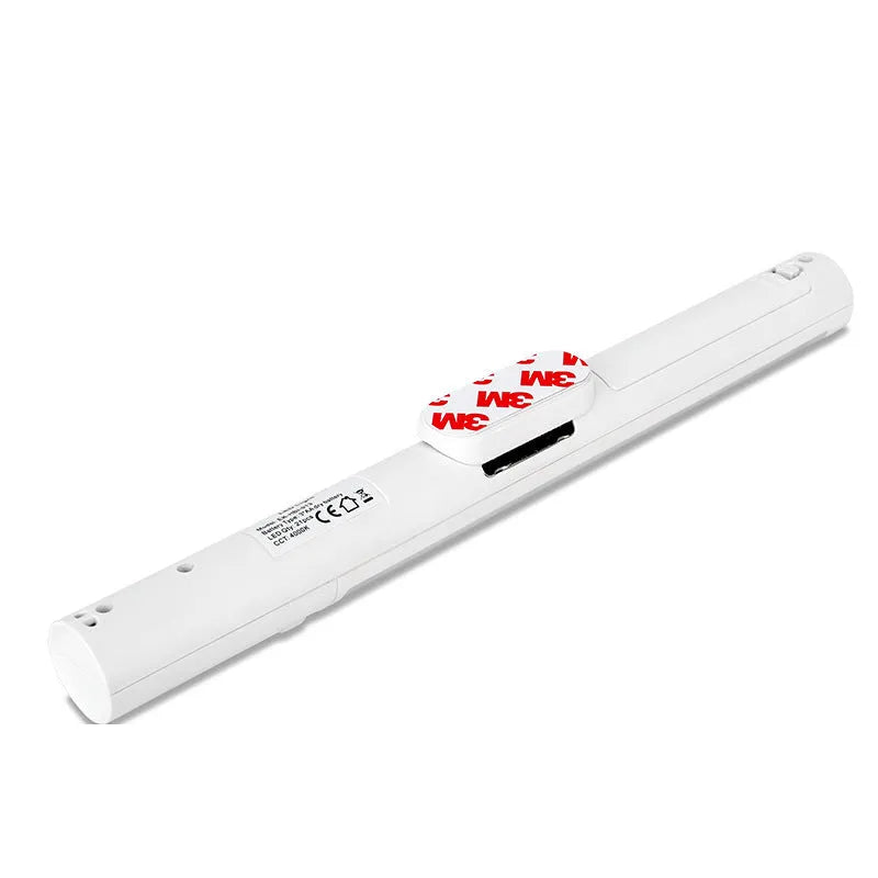 Battery-powered infrared sensor LED wall light with magnetic mount for cabinets.