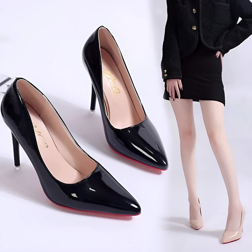 Women's black pointed toe stiletto pump with a shallow cut, shown on a white background.