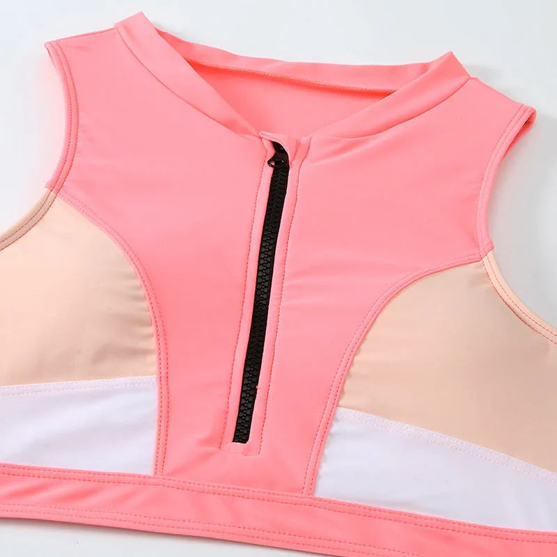 Pink high waist bikini swimsuit set with briefs and a bra on a mannequin.