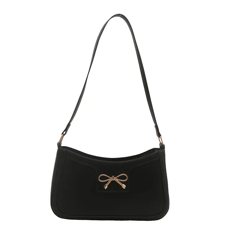 Portable shoulder western style bagg bag in PU with bow accent, available in six colours, 24x14x5 cm