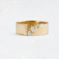 Gold-colour women's ring with shining zircon stone on copper base