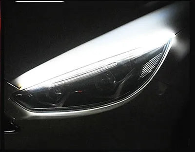 Silicone car LED daytime running light strip with wires, showing flowing turn signal effect.
