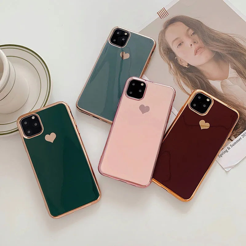 Solid colour blue TPU iPhone back cover case shown next to a claret pink and green version.