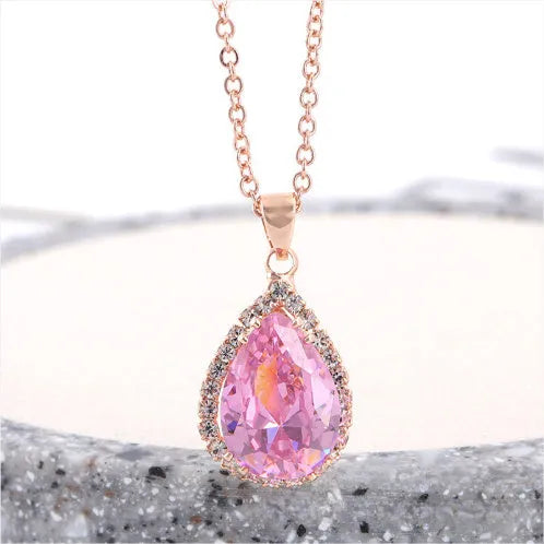 Women's drop shape necklace with rhinestone inlay and geometric design in pink colour option