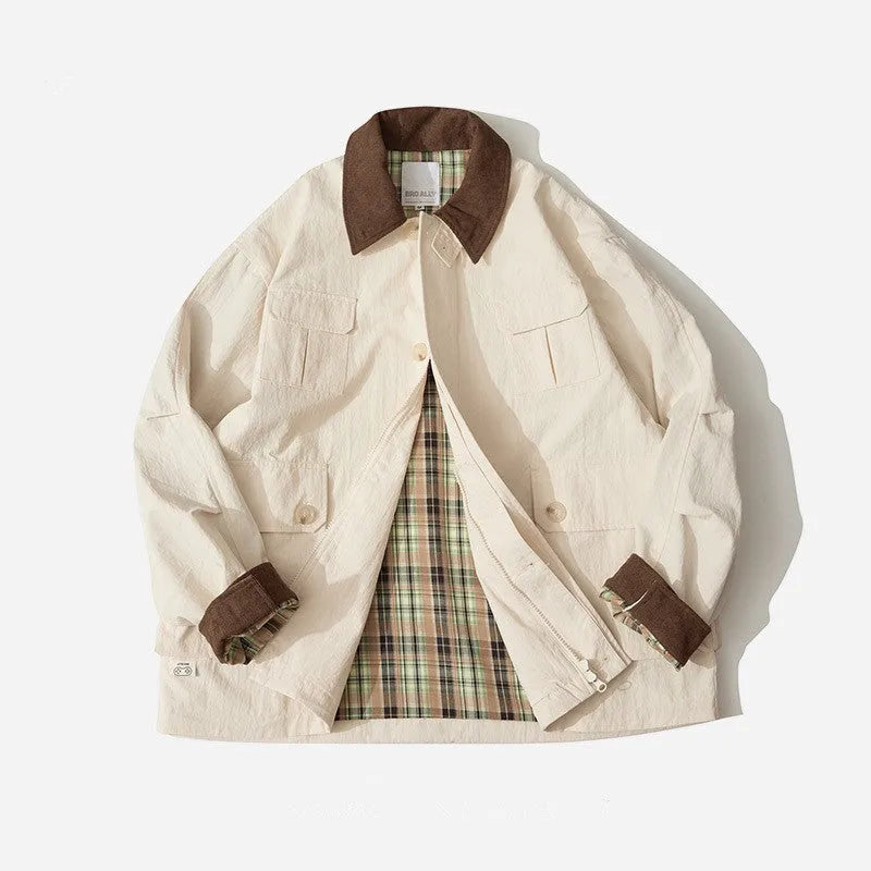 Green solid colour casual jacket with long sleeves and side seam pockets on a hanger