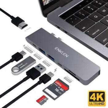 Silver aluminium USB-C 7-in-1 hub adapter with SD card, Micro SD, HDMI, USB 3.0, and Power Delivery ports.