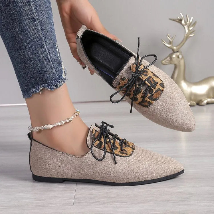 Beige leopard print women's plus size pointed toe pumps with a faux PU upper and rubber sole.