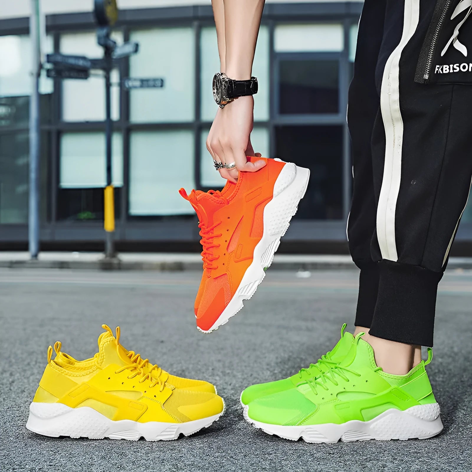 Men's green low-top casual shoes with mesh upper and cross shoulder straps on a flat sole.