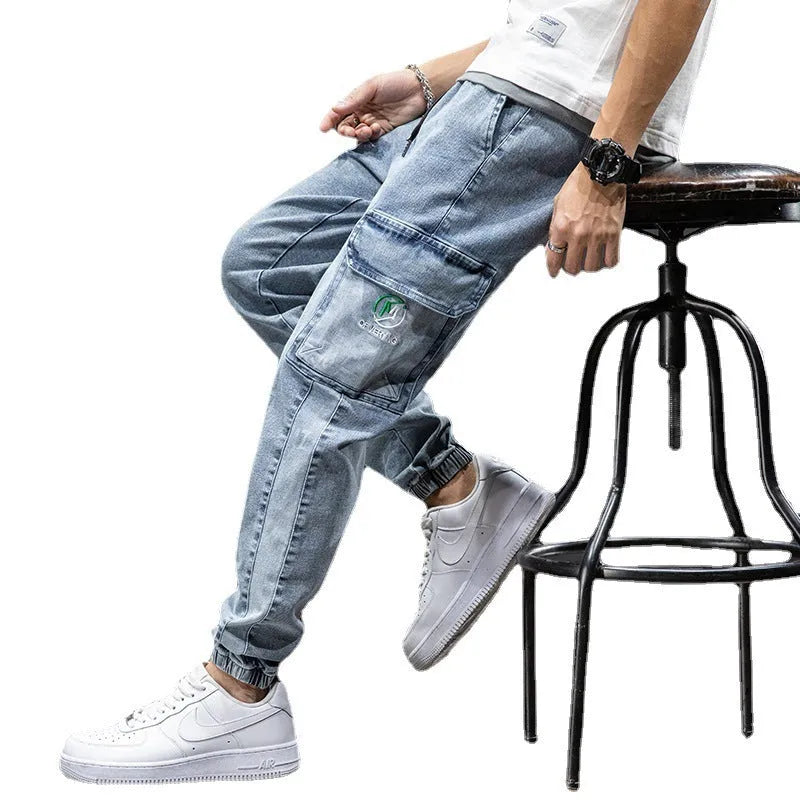 Men's straight leg cargo jeans in blue, showing loose fit, cargo pockets, and mid waist design.
