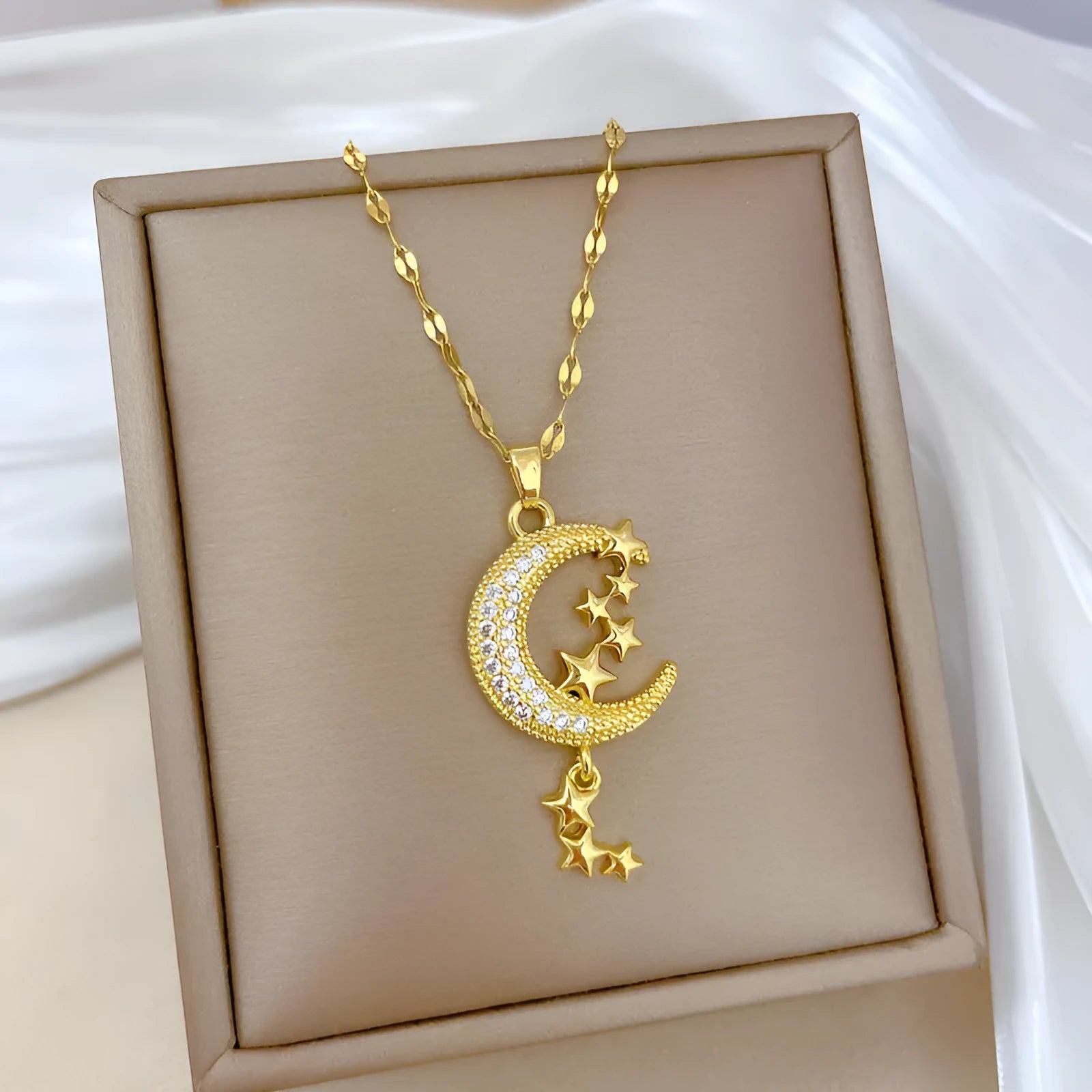 Moon pendant necklace with geometric tassel design and diamond embellishment on stainless steel chain