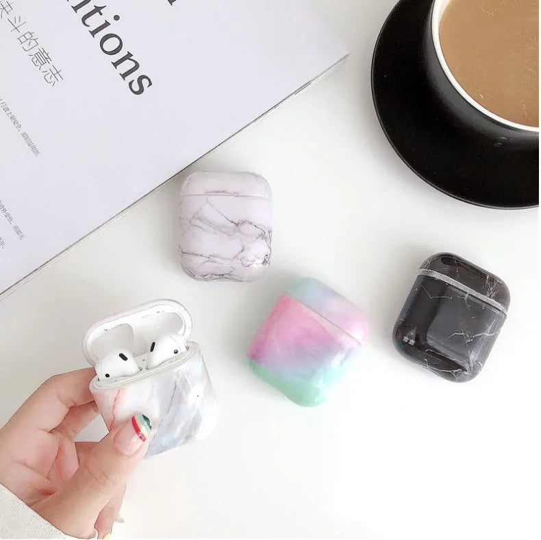 White marble crack pattern hard plastic protective case for Apple AirPods 1 and 2 charging box.