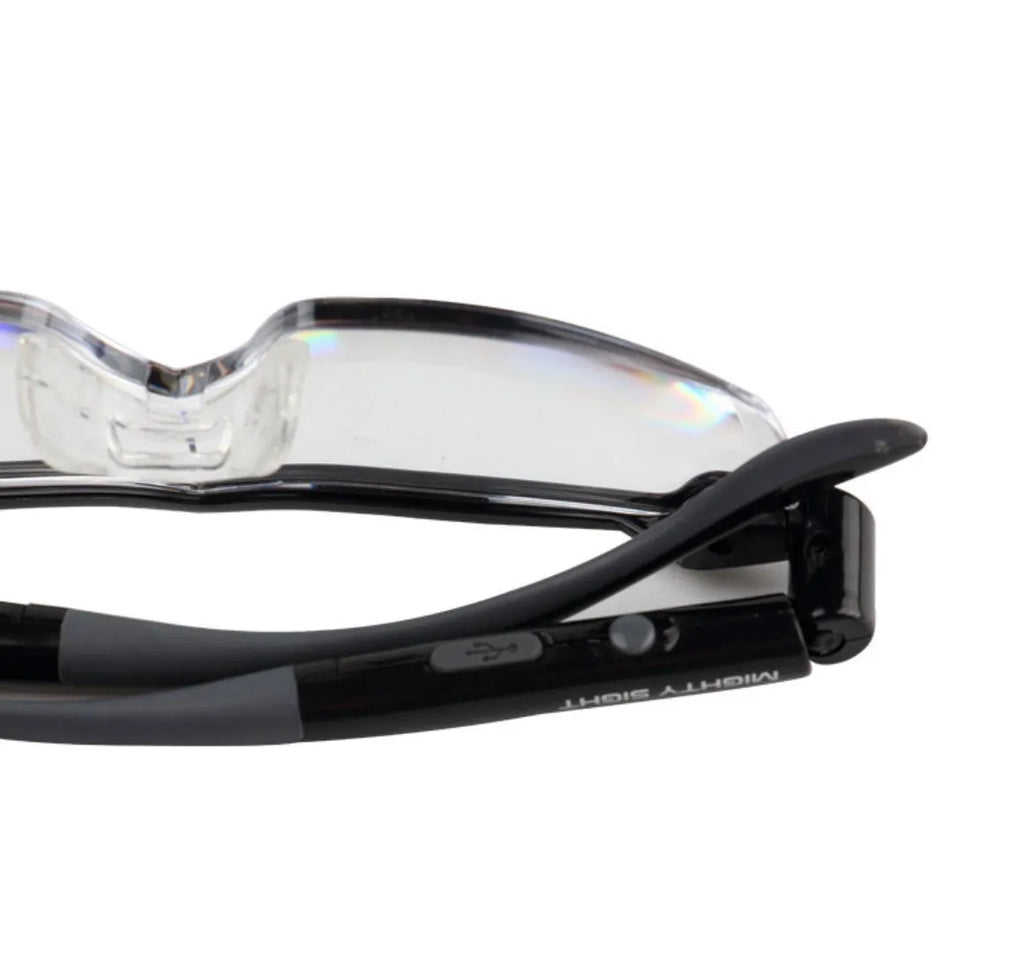 Transparent black USB LED reading glasses with built-in light on frame.