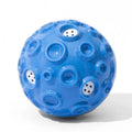 Durable natural rubber dog chew toy ball in assorted colours with a textured surface.