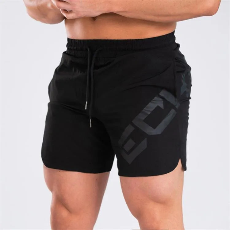 Man wearing black quick-dry nylon sports shorts with an elastic waistband, suitable for running and summer training.