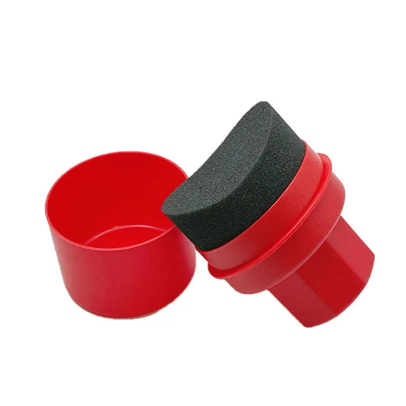 Black and red tyre polishing sponge brushes with PP handles and protective lids on a garage worktop