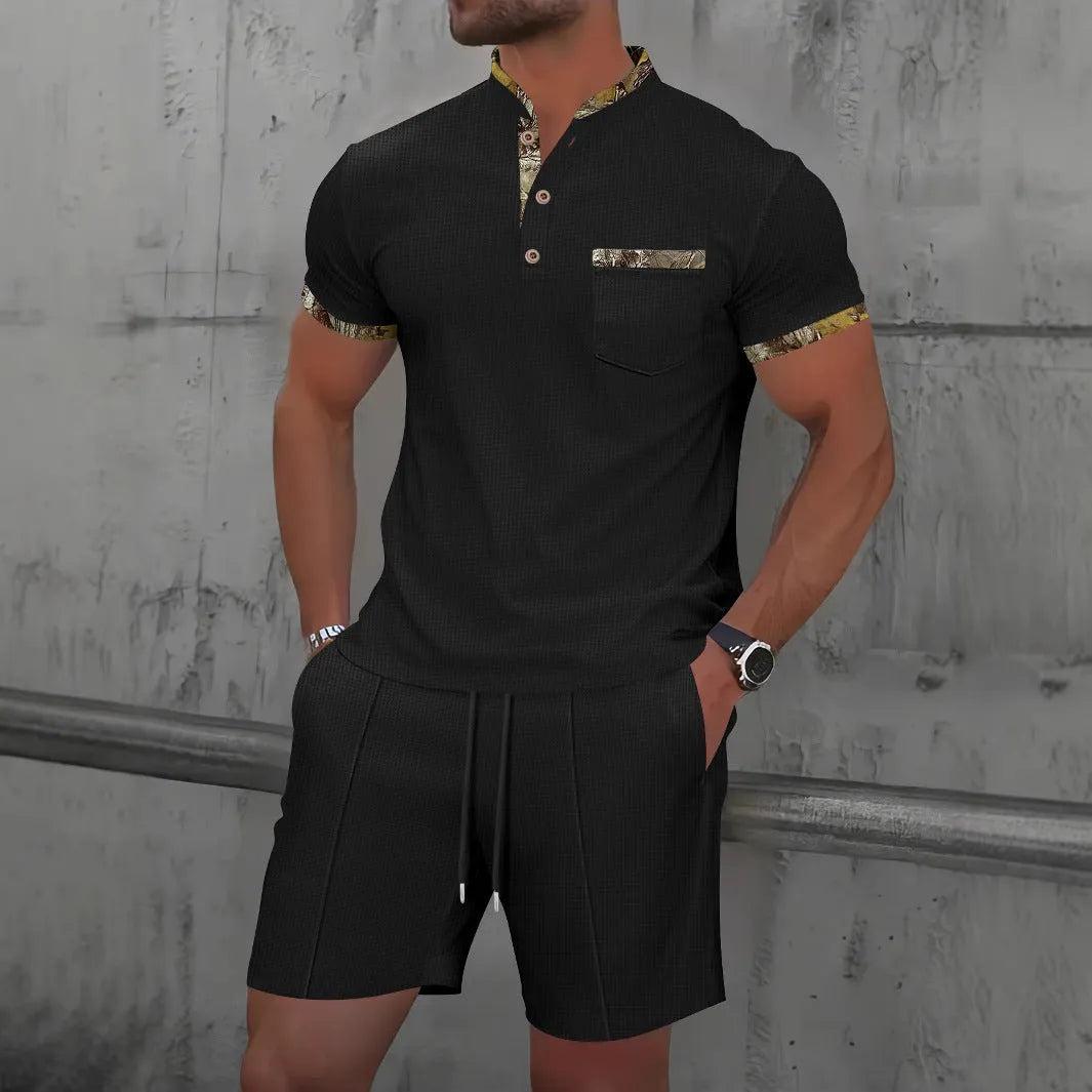 Men's grey sport suit with short sleeve polo collar top and matching shorts on mannequin