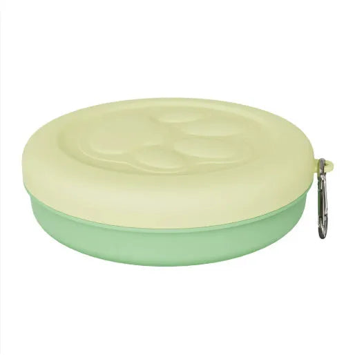 Portable dog bowl with snack box compartment in two-tone light green colour