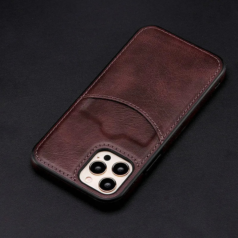 Dark blue PU leather protective case fitted on an iPhone 14 Pro Max smartphone.