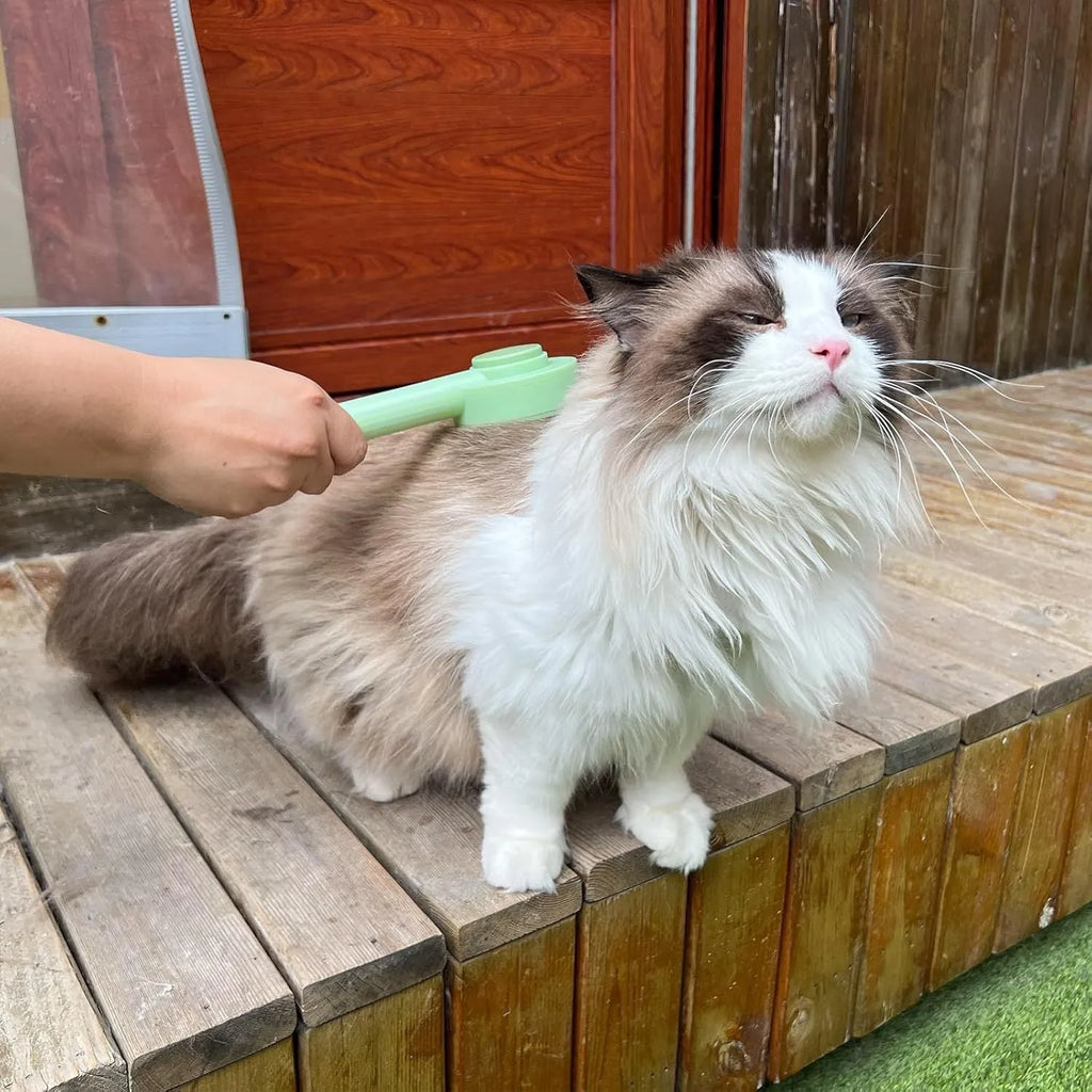 Green and yellow pet grooming brush with stainless steel teeth for cats and dogs