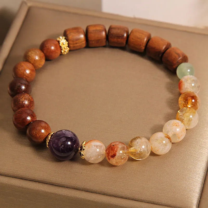 Women's crystal bracelet in yellow tower crystal, ebony, amethyst with pearl and sequin accents