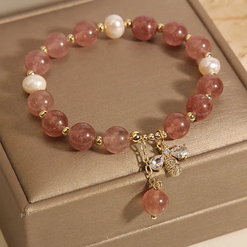 Pink strawberry quartz and white freshwater pearl bracelet with bee charm and zircon accents