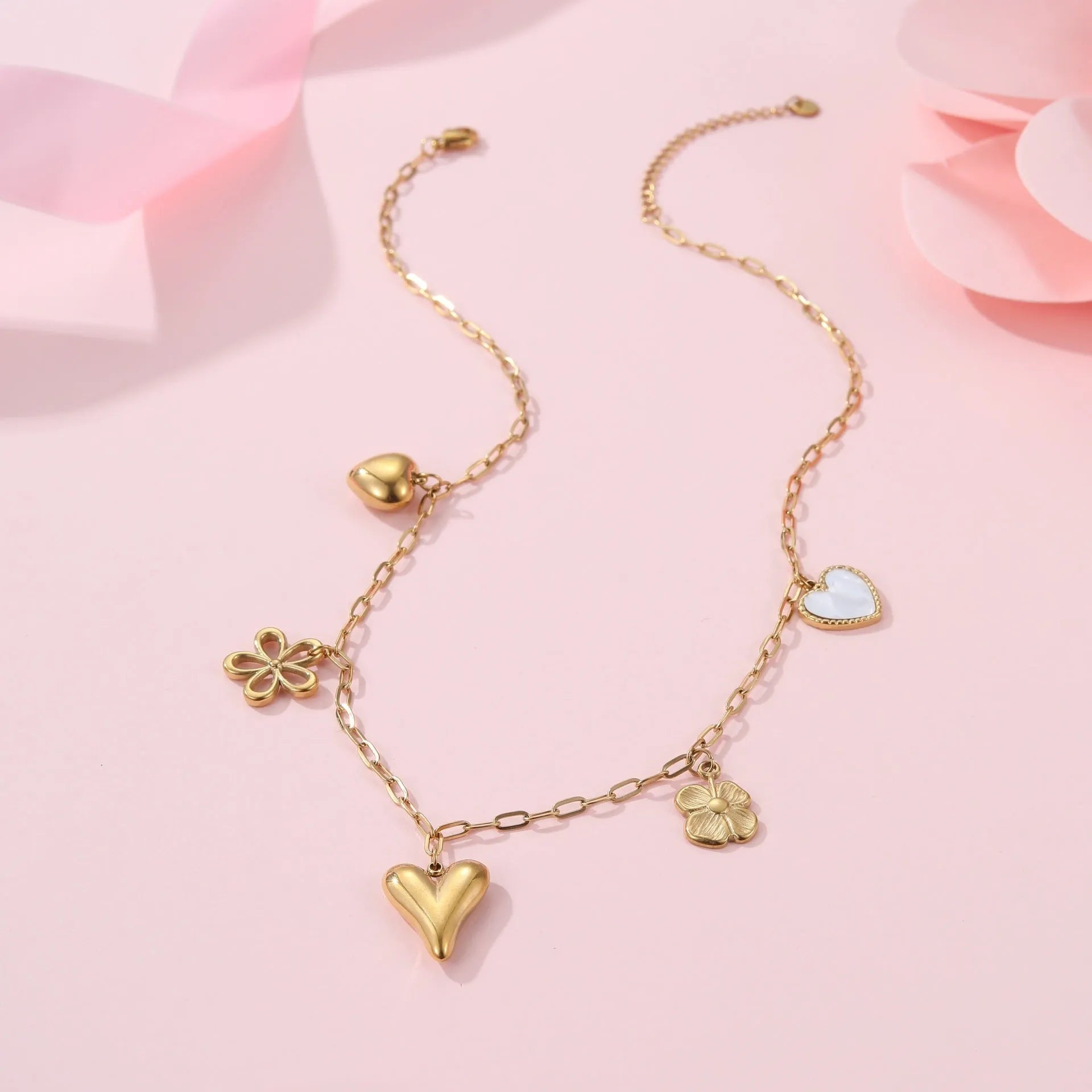 Gold plated stainless steel necklace with a geometric sun pendant on an adjustable chain.