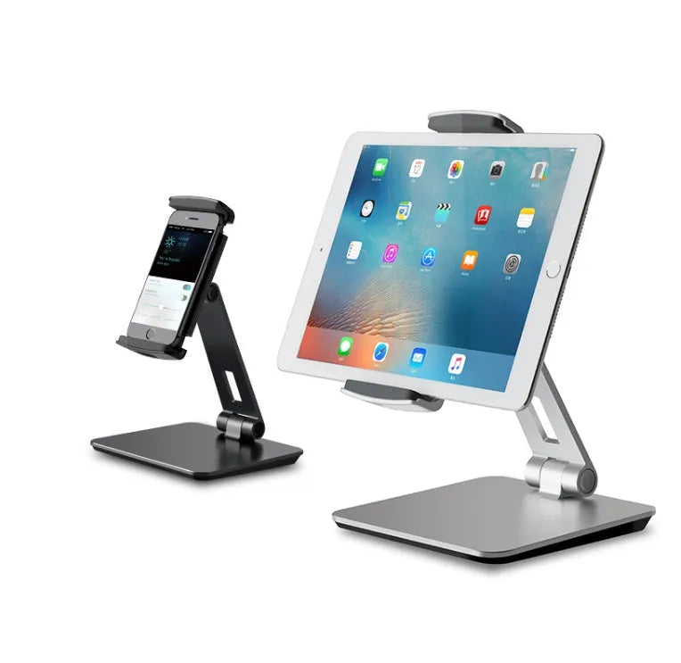 Silver folding aluminium phone and tablet stand with 360° rotation on wooden desk