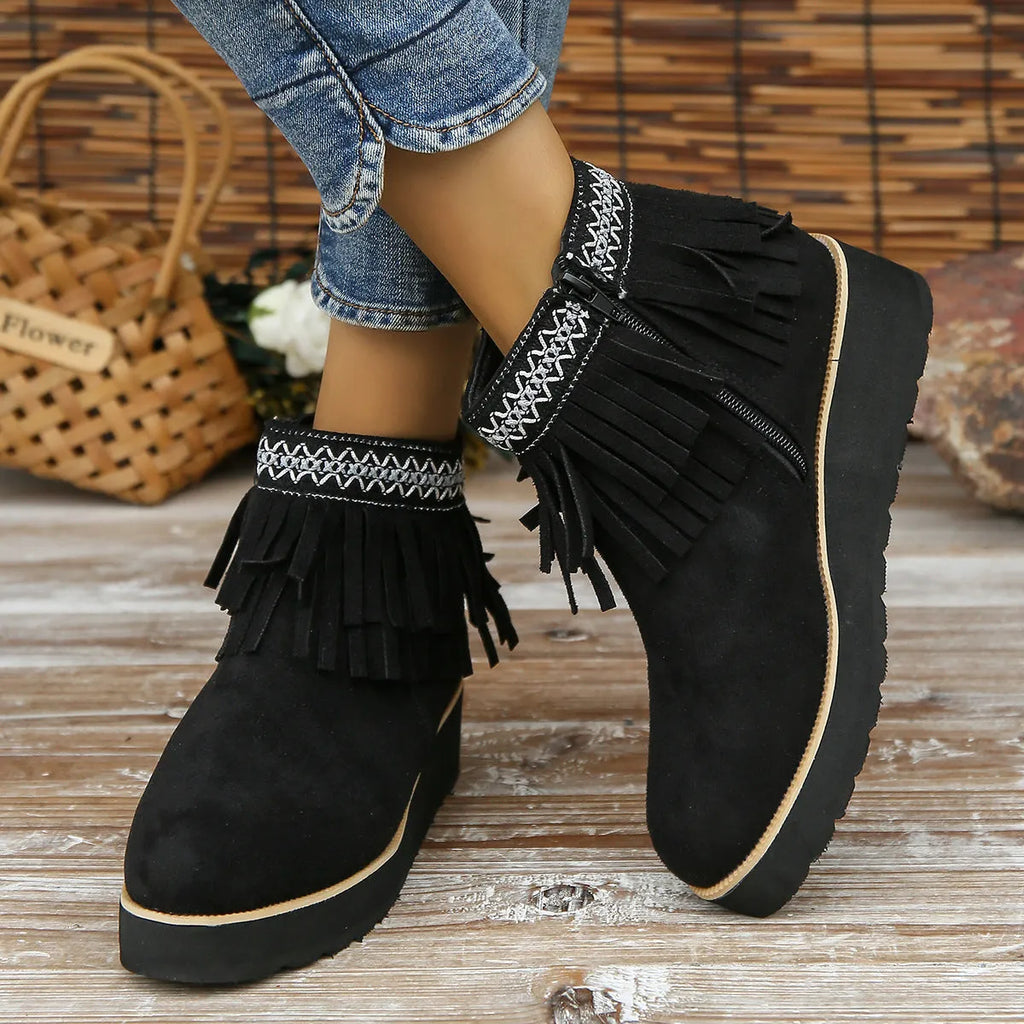 Women's suede wedge ankle boots in dark brown with a side zipper and tassel detail.