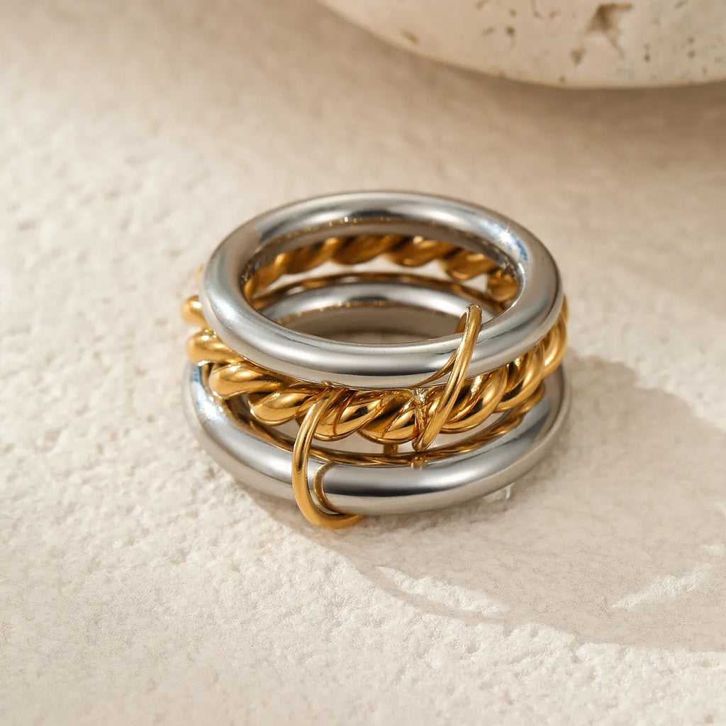 Stacked stainless steel rings with 18K gold plating in colour-matched set for women