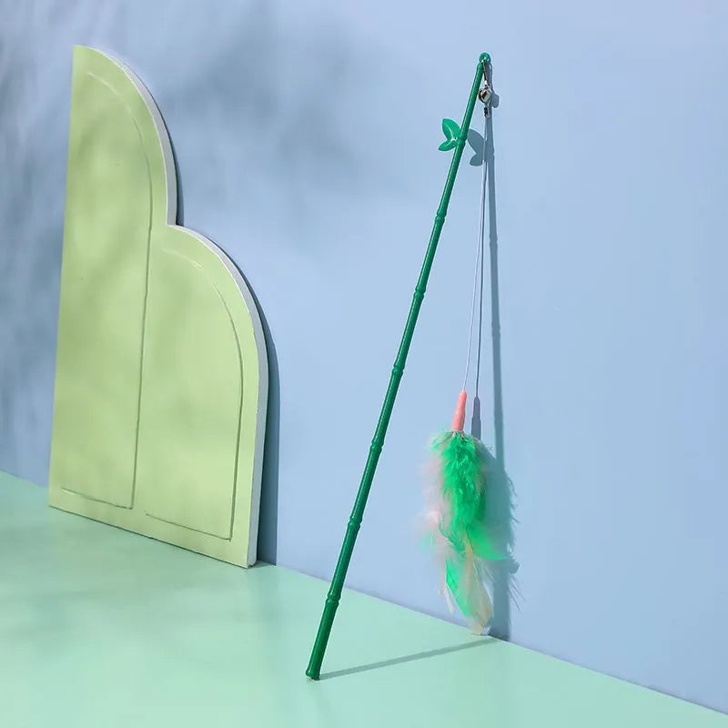 Green interactive cat feather wand with bells and feathers, durable play toy