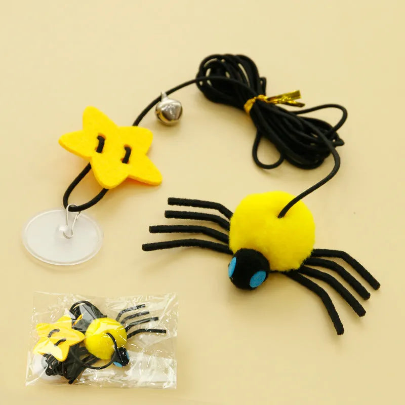 Red and yellow hanging door cat toy with swinging elastic rope, feather, and bell attachments