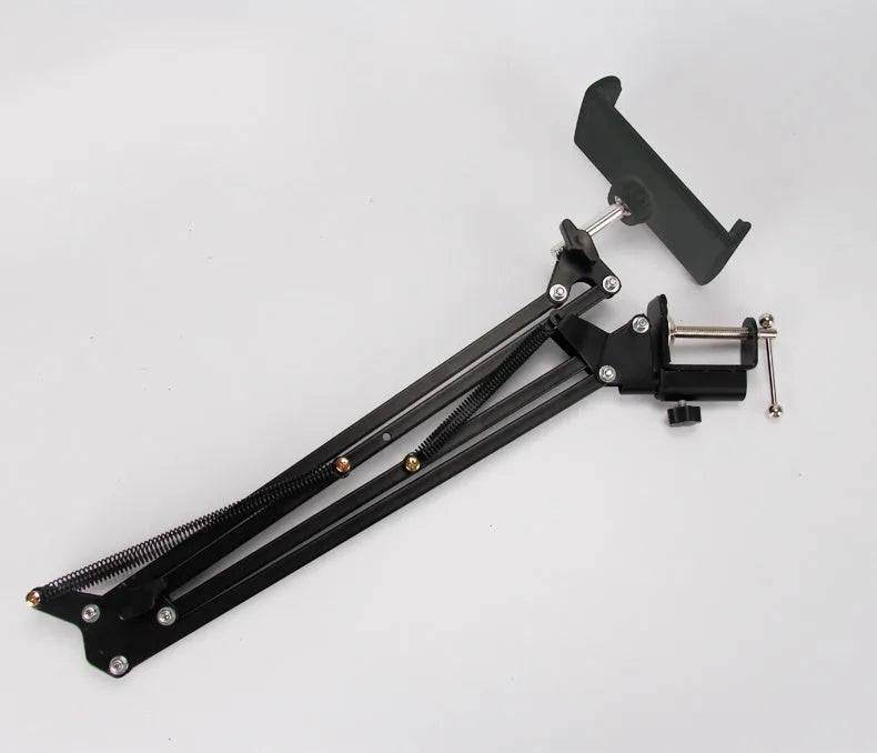 Support phone tablet stand in black on a desk, holding a smartphone for hands-free viewing