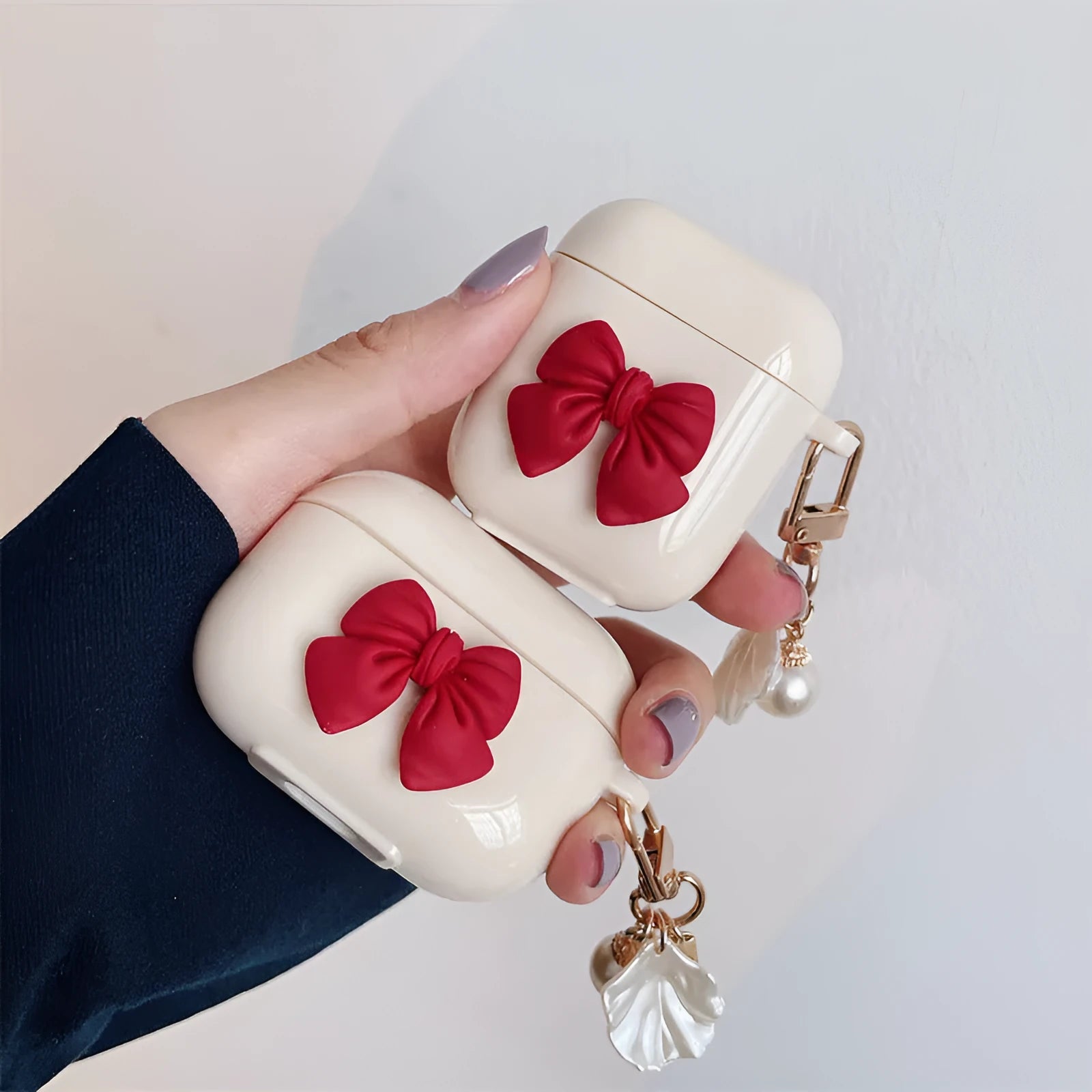Beige red bow shell patterned TPU protective case for Apple AirPods Pro and AirPods 1, 2, 3 wireless earphones.