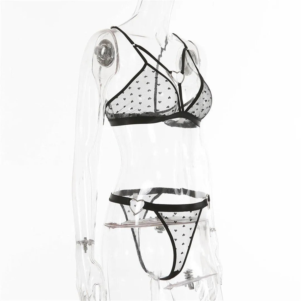 Ladies' black spandex two-piece set with mesh detailing on the top and matching trousers.
