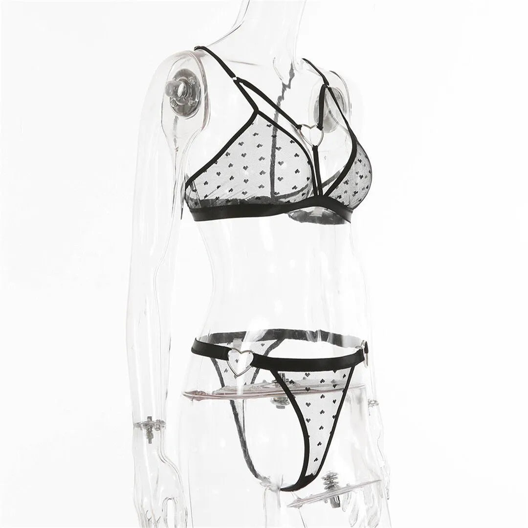 Ladies' black spandex two-piece set with mesh detailing on the top and matching trousers.