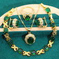 18k gold plated jewellery set with cubic zirconia stones, showing necklace, earrings, bracelet, and ring.