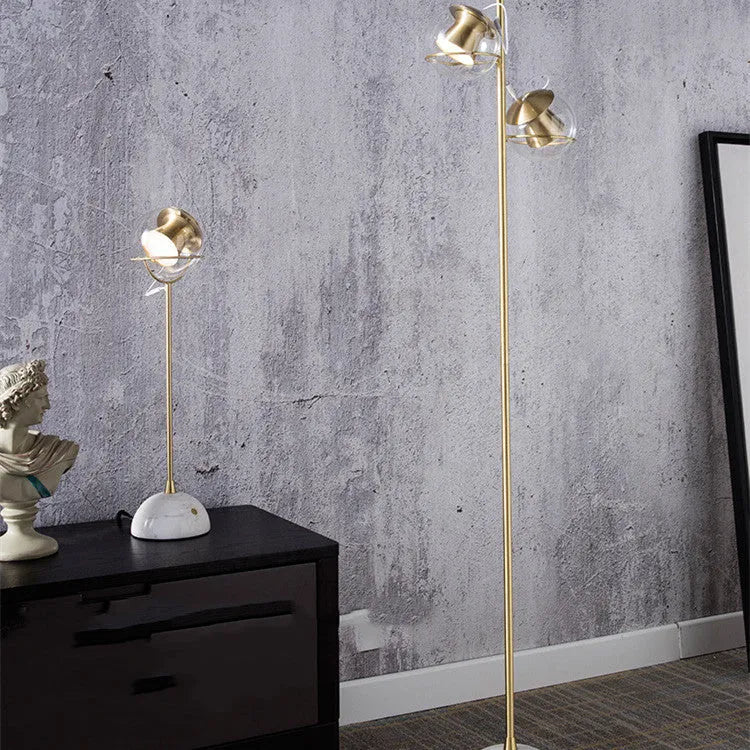 Glass desk lamp with dimmable touch control and LED light source on desk surface
