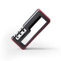 Black and red three-stage knife sharpener with non-skid rubber feet on a worktop
