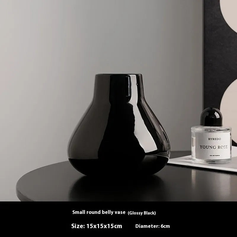 Ceramic decorative vase set with artificial orchid flowers in black or white coloured glaze finish