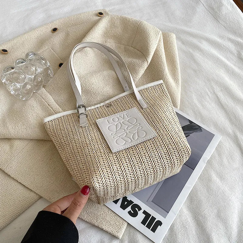 Straw woven women's shoulder bag in white or black with large capacity and retro sewing thread details