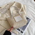 Straw woven women's shoulder bag in white or black with large capacity and retro sewing thread details
