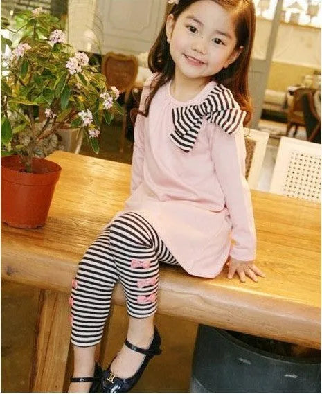 Pink cotton girls clothing set shown in sizes for children 110cm to 140cm tall.