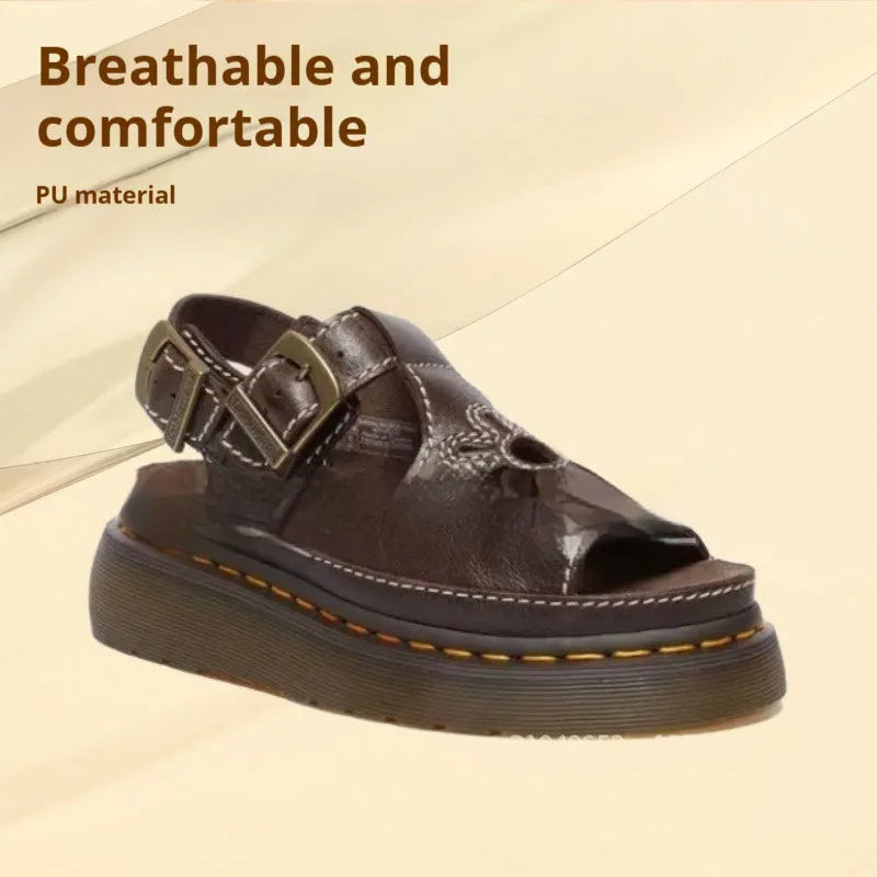 Men's black embroidered floral beach sandals with flat heel on a plain background.