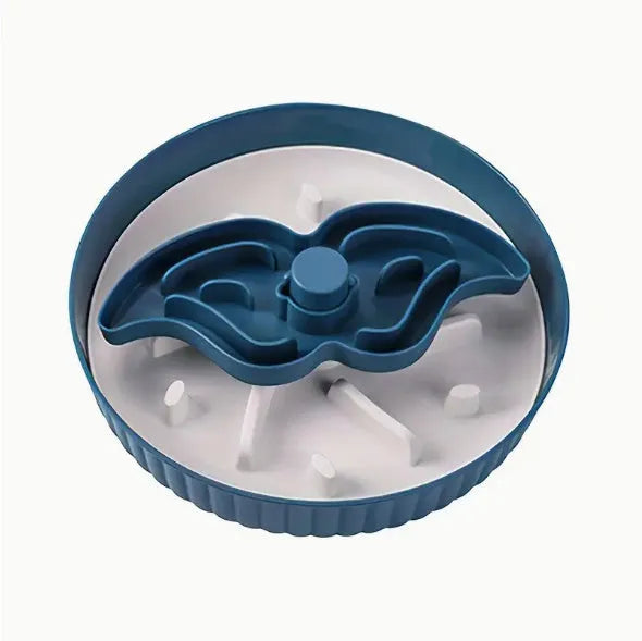 Rotating pet slow feeder bowl with silicone anti-choke pad in blue, showing game board texture.